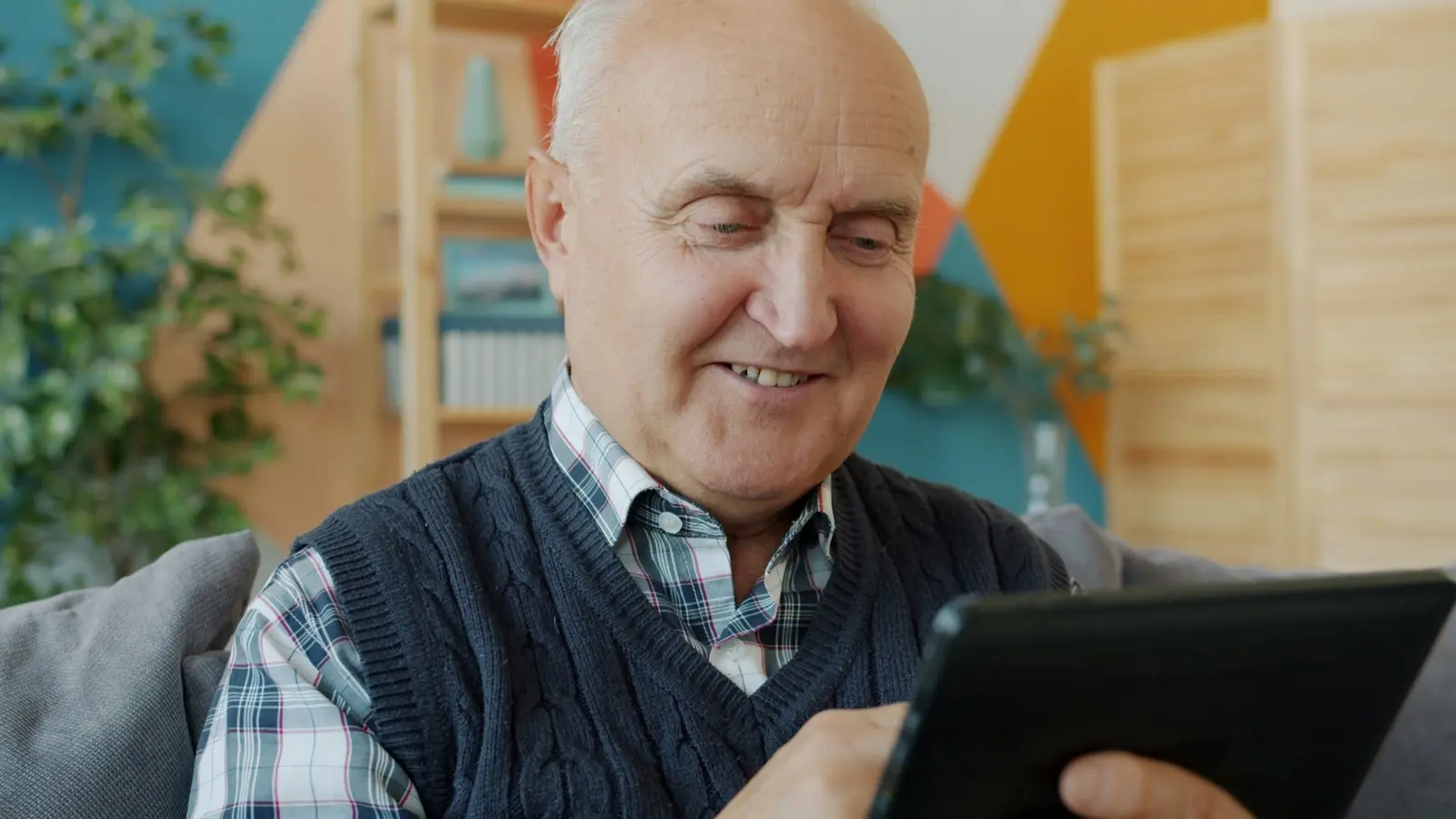 An older adult checking in with Lily, the AI wellness coach, on a tablet at home